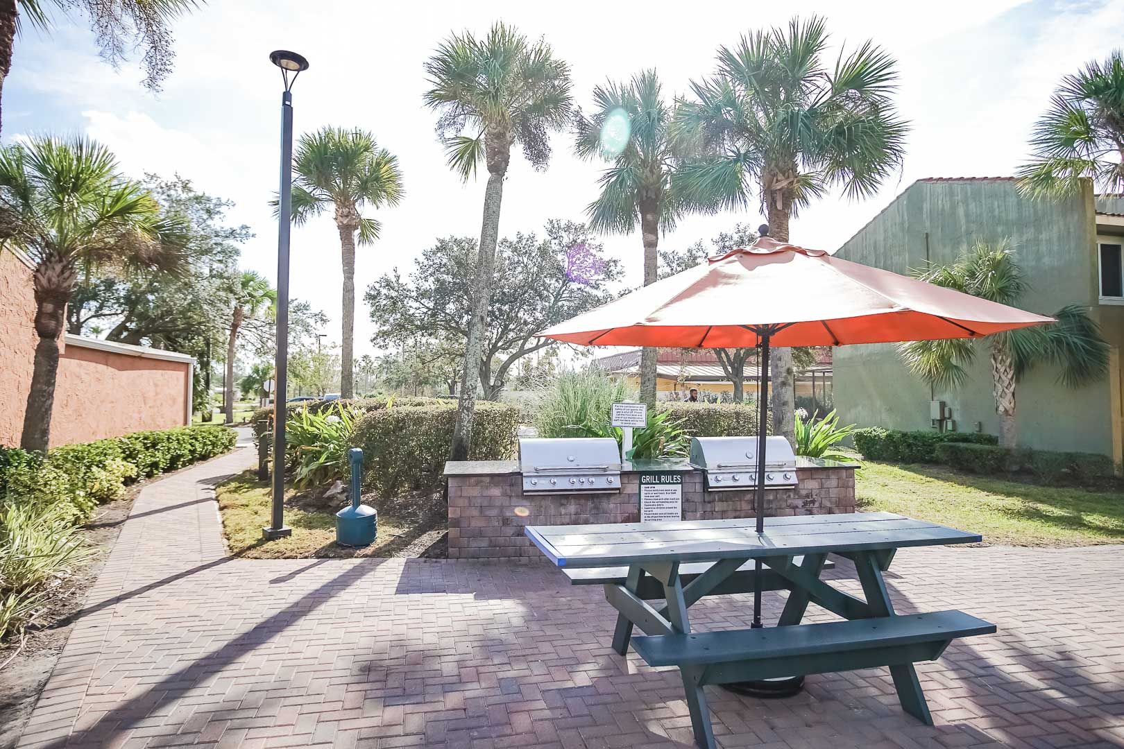 BBQ grills and sitting area at VRI's Fantasy World Resort in Florida.